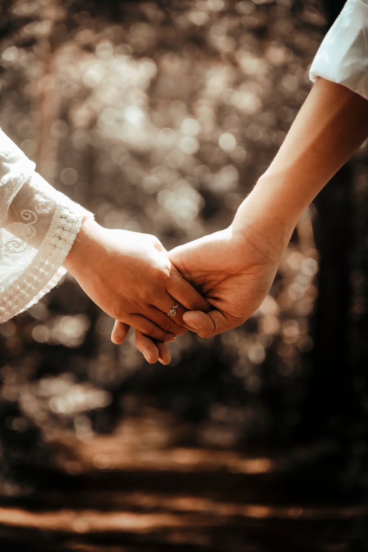 Couple Holding Hands Outdoors