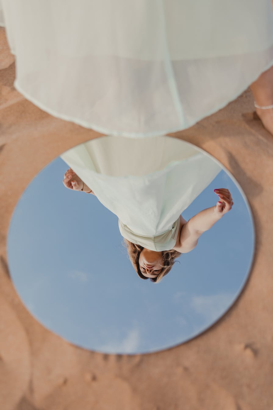 Woman in White Dress Reflected on Mirror
